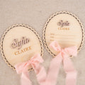 Personalized scalloped oval baby name plaque and matching birth stat plaque with pink ribbon, name Sofia Claire