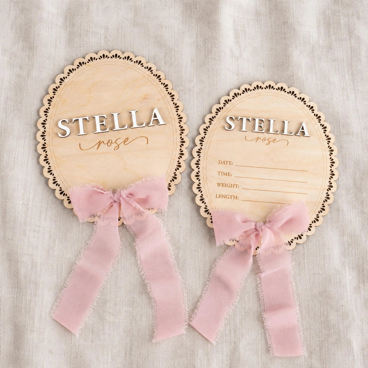 Scalloped baby name plaque and birth announcement sign with pink ribbon, name Stella Rose